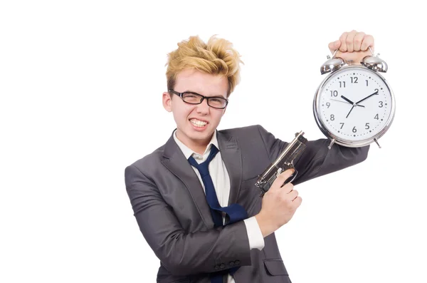 Joven hombre de negocios pistola holidng y reloj despertador aislado en blanco —  Fotos de Stock