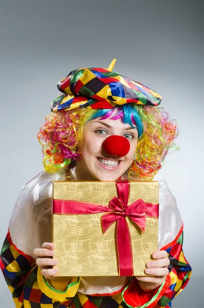 Clown with giftbox in funny concept — Stock Photo, Image