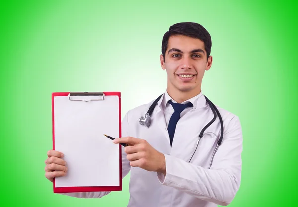 Lekarz mężczyzna na białym tle na zielono — Zdjęcie stockowe