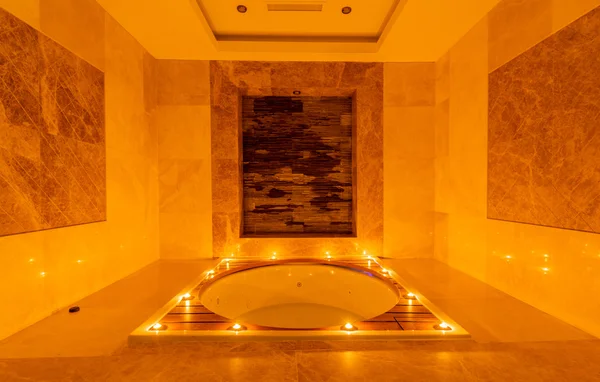 Spa room with burning candles