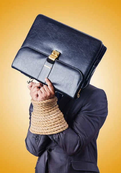 Businessman tied up with rope — Stock Photo, Image