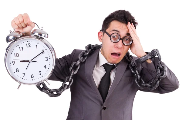 Empresario con reloj despertador aislado en blanco — Foto de Stock