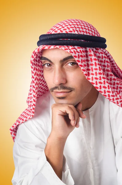 Jonge Arabische geïsoleerd op de gele — Stockfoto