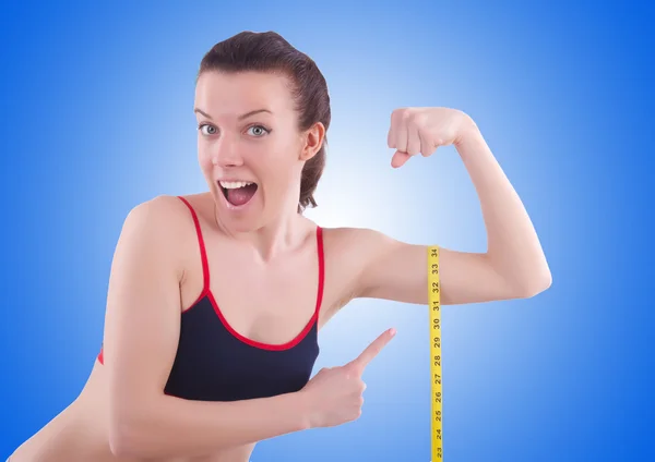 Young girl with centimeter in dieting concept — Stock Photo, Image