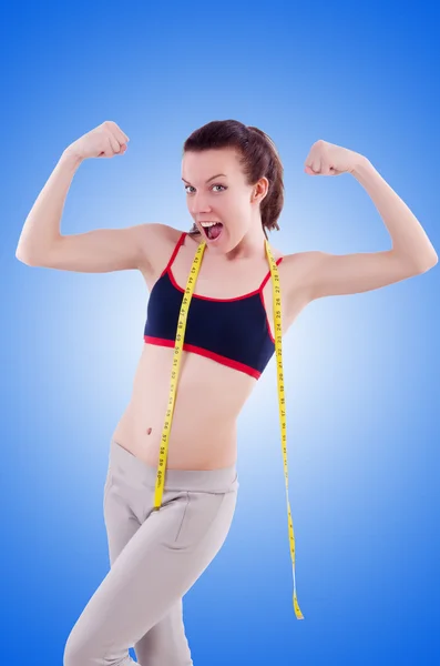 Young girl with centimeter in dieting concept — Stock Photo, Image