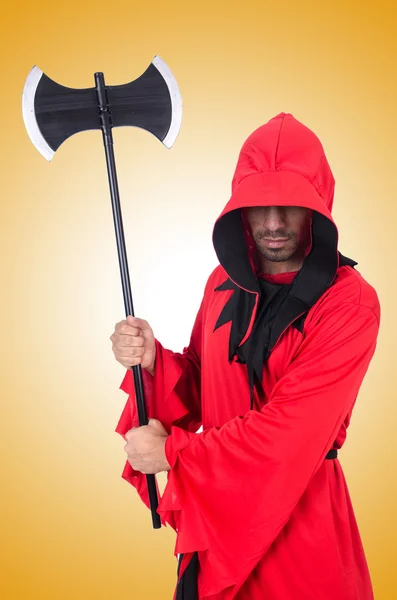 Executioner in red costume with axe — Stock Photo, Image