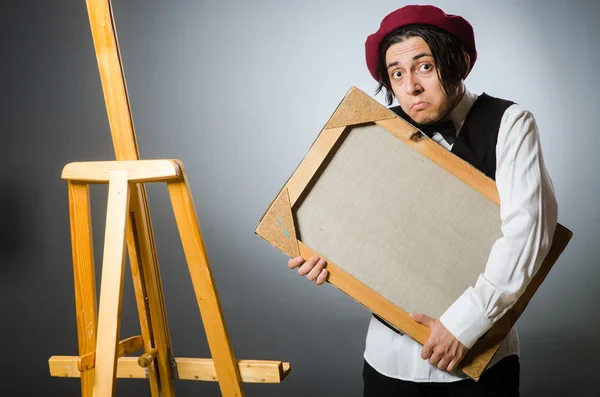 Funny artist in dark studio — Stock Photo, Image