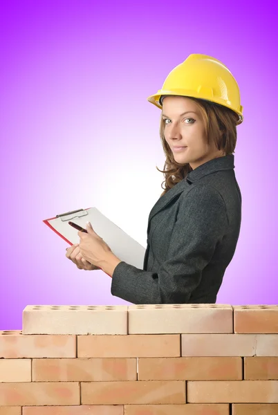 Woman architect near brick wall — Stock Photo, Image