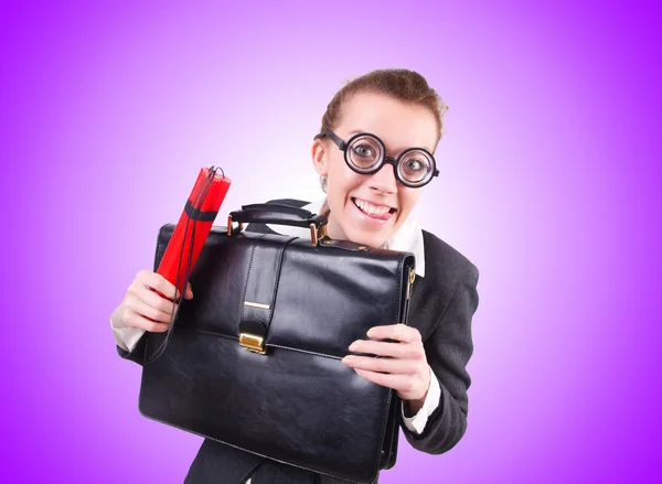 Businesswoman with dynamite on purple — Stock Photo, Image