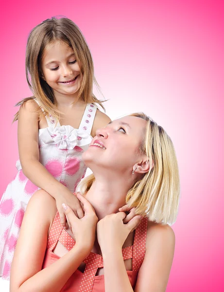 Feliz mamá y su hija en blanco — Foto de Stock