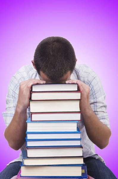 Student with lots of books — Stockfoto