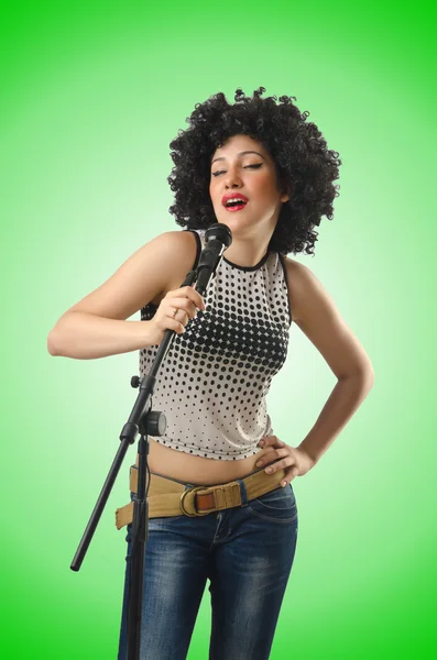 Woman with afro haircut on green — Stock Photo, Image