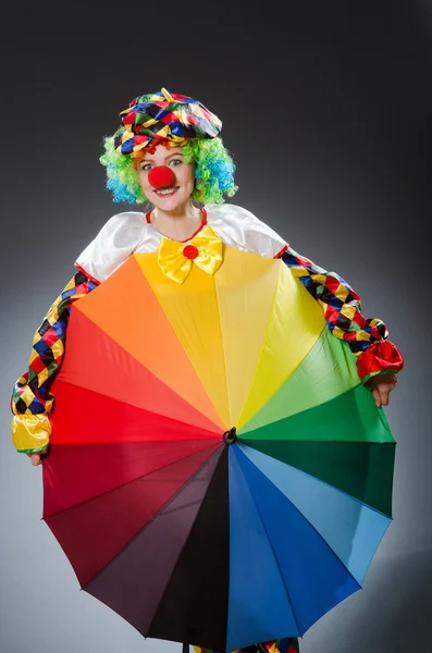 Clown with umbrella in funny concept — Stock Photo, Image