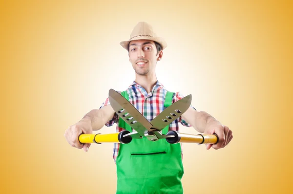 Man gardener with shears — Stock Photo, Image