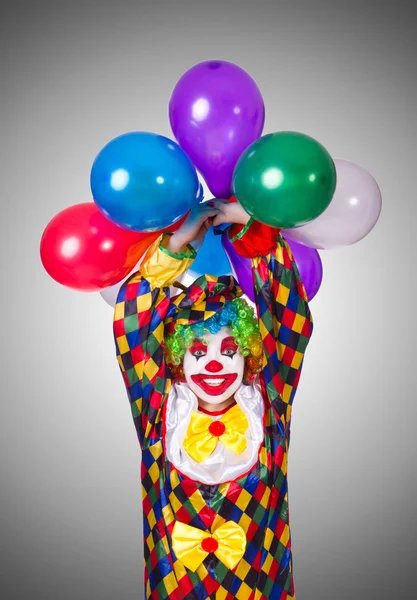 Lustiger Clown isoliert auf dem grauen — Stockfoto