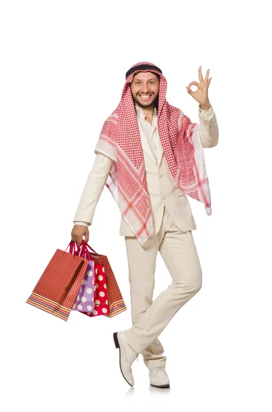 Arap adam alışveriş torbaları üzerinde beyaz ile — Stok fotoğraf