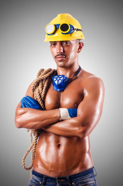 Muscular builder with tools — Stock Photo, Image