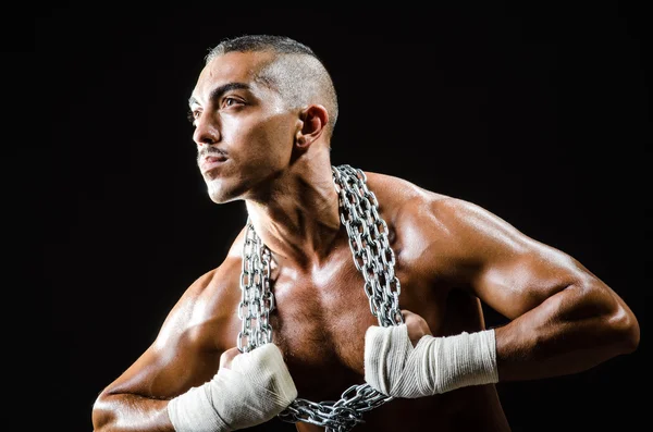 Muscular man with metal chain — Stock Photo, Image