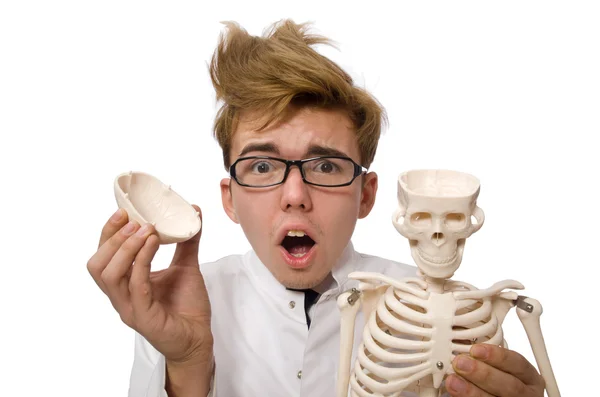 Funny doctor with skeleton isolated on white — Stock Photo, Image