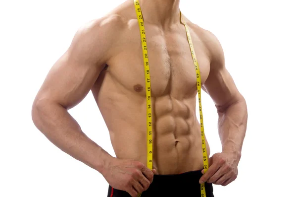 Muscular man measuring his muscles — Stock Photo, Image