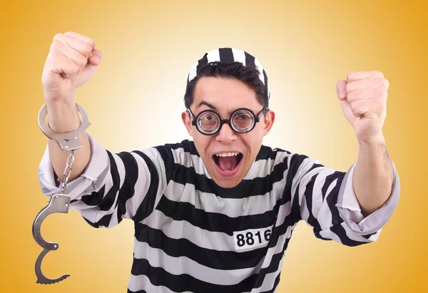 Funny convict isolated on the yellow — Stock Photo, Image