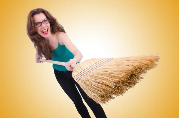 Young woman with broom — Stock Photo, Image