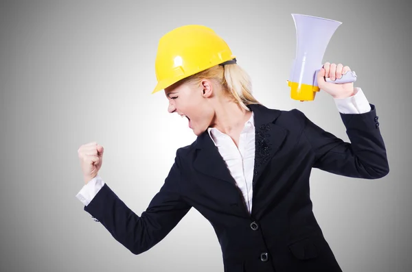 Female construction worker with loudspeaker — Stock Photo, Image