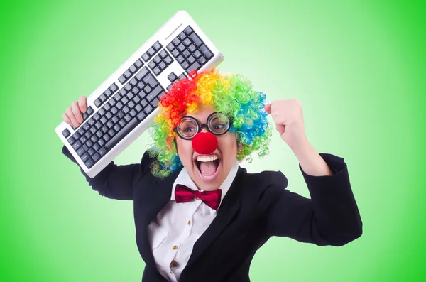 Grappige clown met toetsenbord — Stockfoto
