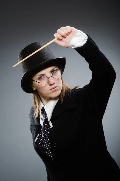 Harry Potter girl with magic stick against gray — Stock Photo, Image