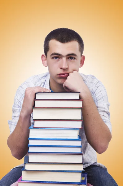 Student with lots of books — Stockfoto