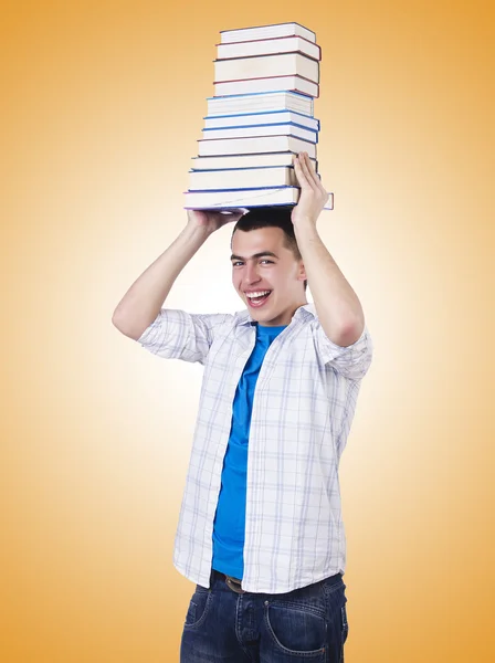 Student mit vielen Büchern — Stockfoto