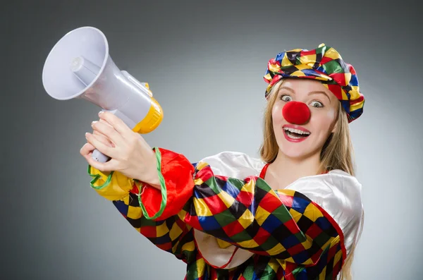 Clown with loudspeaker isolated gray — Stock Photo, Image