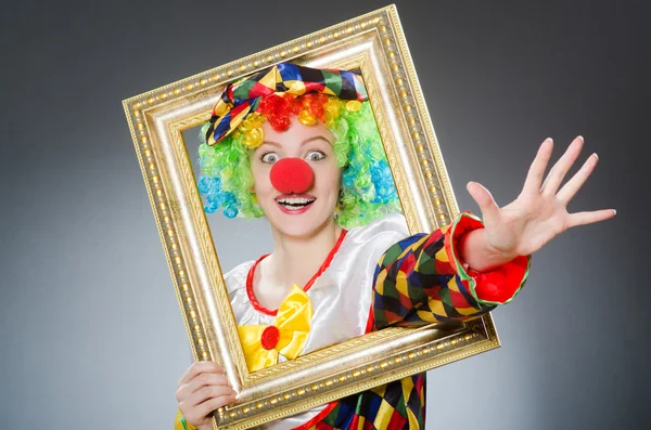 Clown with picture frame in funny concept — Stock Photo, Image