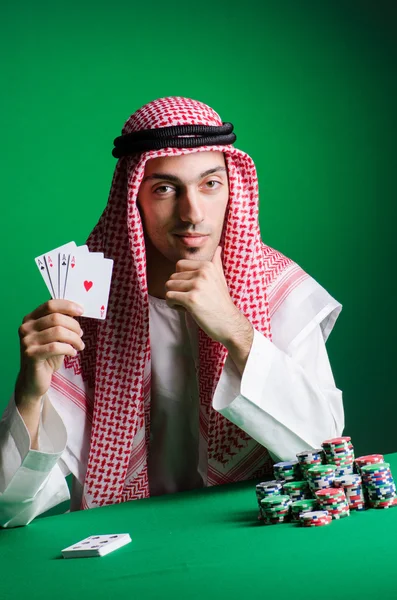 Arab man playing in the casino — Stock Photo, Image