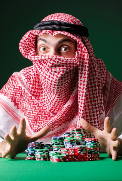 Arab man playing in the casino — Stock Photo, Image