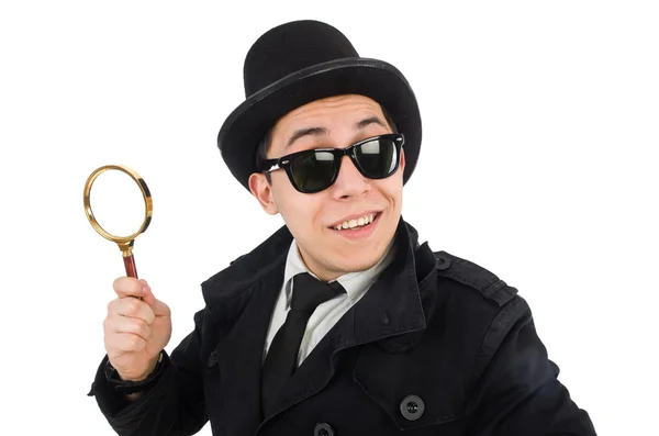 Young detective in black coat holding magnifying glass isolated — Stock Photo, Image