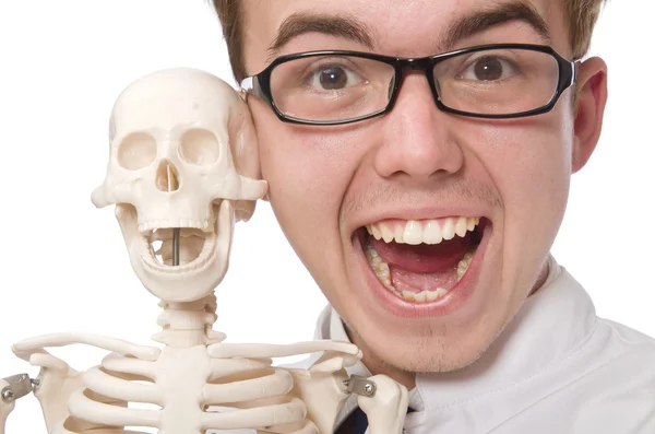 Funny doctor with skeleton isolated on white — Stock Photo, Image