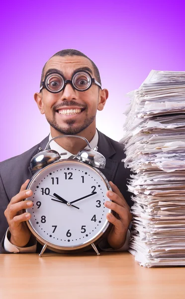 Businesswoman with giant alarm clock — Stock Photo, Image