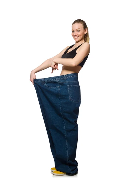 Concetto di dieta con grandi jeans su bianco — Foto Stock