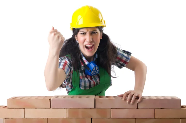 Angry female construction worker on white — Stock Photo, Image