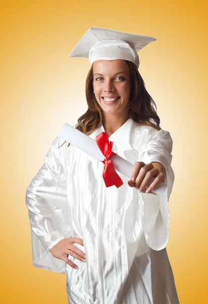 Giovane studente con diploma su bianco — Foto Stock