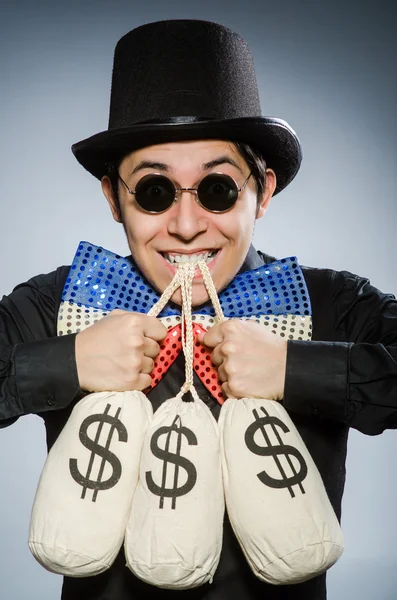 Vtipný muž s pytli na peníze — Stock fotografie