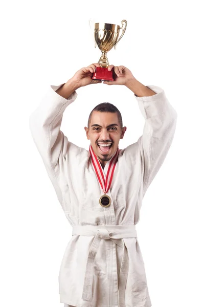 Lustige Karate-Kämpferin mit Pokal auf weiß — Stockfoto