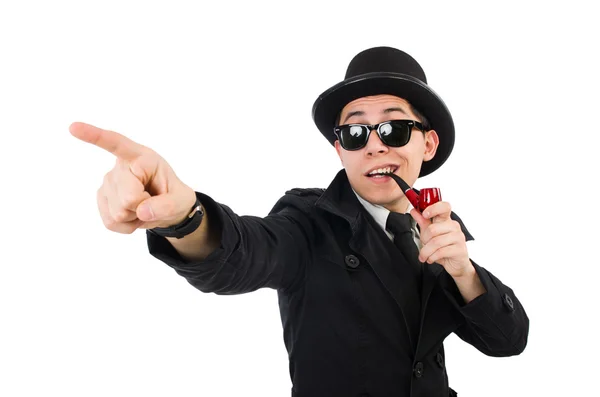 Young detective in black coat holding magnifying glass isolated — Stock Photo, Image