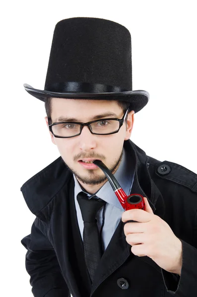 Молодой детектив с дымящейся трубкой изолирован на белом — стоковое фото