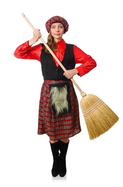 Femme drôle en vêtements écossais avec balai — Photo
