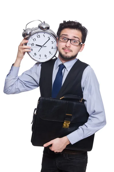 Joven empresario con reloj despertador aislado en blanco — Foto de Stock