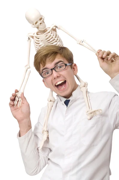 Funny doctor with skeleton isolated on white — Stock Photo, Image