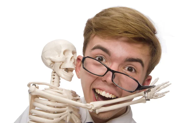 Funny doctor with skeleton isolated on white — Stock Photo, Image