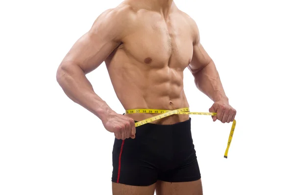 Muscular man measuring his muscles — Stock Photo, Image